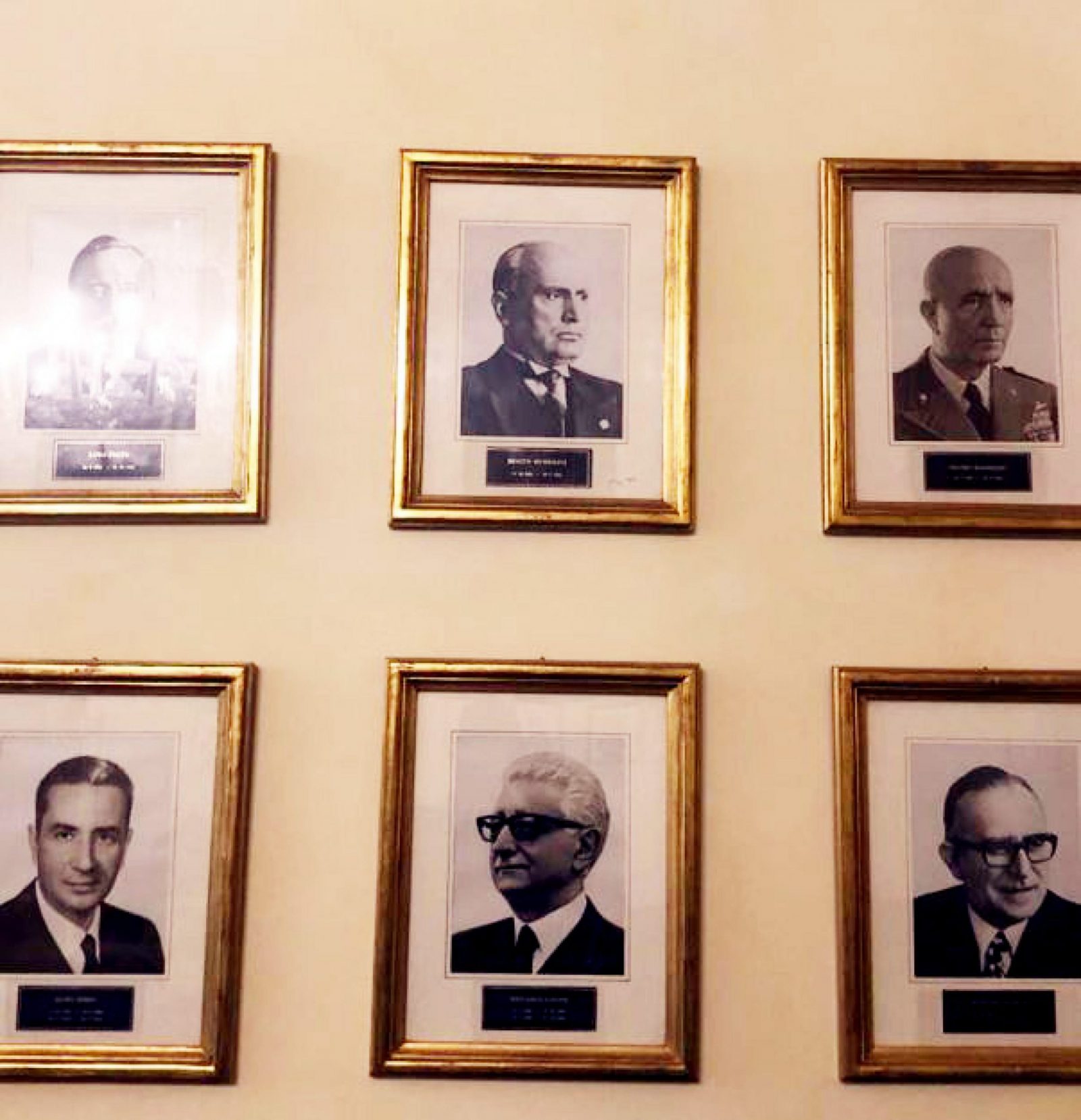 epa10251118 An undated handout photo made available by the Chigi Palace press office shows portraits, including one of fascist dictator Benito Mussolini (top C), up a wall at the Italian industry minstry in Rome, Italy (issued 18 October 2022). A photo of Fascist dictator Benito Mussolini was removed form the industry ministry on 18 October after it was put on show along with all the other predecessors of outgoing industry minister Giorgetti for the 90th anniversary of the building. The ministry said the photo would be removed "to avert polemics and instrumentalizations". Giorgetti had previously pointed out that a photo of the dictator is in the premier's office too. "No one has noticed that (Mussolini's photo) is also in Palazzo Chigi, not only at the industry ministry," had said Giorgetti, who is tipped to take the key economy minister's portfolio in Georgia Meloni's likely new cabinet. Asked why the dictator's photo had been put up in his ministry now, Giorgetti replied that Mussolini had been the first corporations minister and that the photos of all the industry ministers in Italian history had been put on display to mark the 90th anniversary of the building, Palazzo Piacentini. "But if there's a problem we will remove it," said the League party bigwig.  EPA/CHIGI PALACE PRESS OFFICE HANDOUT  HANDOUT EDITORIAL USE ONLY/NO SALES