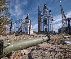 epa10252848 A part of military ammunition lies in front of the destroyed church, which is part of Sviatohirsk Lavra, in the Bohorodychne village of Donetsk area, Ukraine, 19 October 2022 amid the Russian invasion. Bohorodychne village was captured by Russian troops in the summer of 2022 during their offensive on Sviatohirsk and was liberated by the Ukrainian army in September 2022. All buildings of the village were destroyed and from almost 800 inhabitants before the war, just two people stay to live there now. The Ukrainian army pushed Russian troops from occupied territory in the northeast of the country in a counterattack. Russian troops entered Ukraine on 24 February 2022 starting a conflict that has provoked destruction and a humanitarian crisis.  EPA/YEVGEN HONCHARENKO