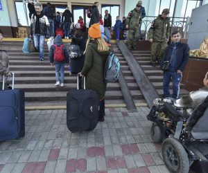 epa10263122 Local people evacuated from Kherson arrive to railway station in Dzhankoi, Crimea, 24 October 2022, where temporary accomodation centers have been set up. The authorities of the Kherson region announced the mass displacement of residents of several municipalities, including the city of Kherson, to the left bank of the Dnieper. According to the Acting Governor of the region Vladimir Saldo, this is necessary because of the increased frequency of attacks by the Armed Forces of Ukraine, as well as in connection with the threat of flooding of the territories due to the possible destruction of the dam of the Kakhovskaya hydroelectric power station. According to the deputy head of the regional administration Kirill Stremousov, about 30,000 people were transported to the other side of the Dnieper.  EPA/STRINGER