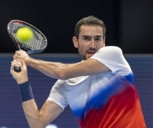 epa10263842 Croatia's Marin Cilic returns a ball to France's Arthur Rinderknech during their first round match at the Swiss Indoors tennis tournament, in Basel, Switzerland, 24 October 2022.  EPA/GEORGIOS KEFALAS