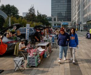 epa10264327 People walk along a car boot fair in Beijing, China, 25 October 2022. China's Gross Domestic Product (GDP) rose to 3.9 percent year-on-year in the third quarter of 2022 which beat the forecast of 3.2-3.3 percent. According to the International Monetary Fund, the forecast for China's growth in 2022 will expand only by 3.2 percent, far from the target of 5.5 percent, the lowest since the 1980's as the economy continues to be disrupted by COVID-19 measures.  EPA/MARK R. CRISTINO