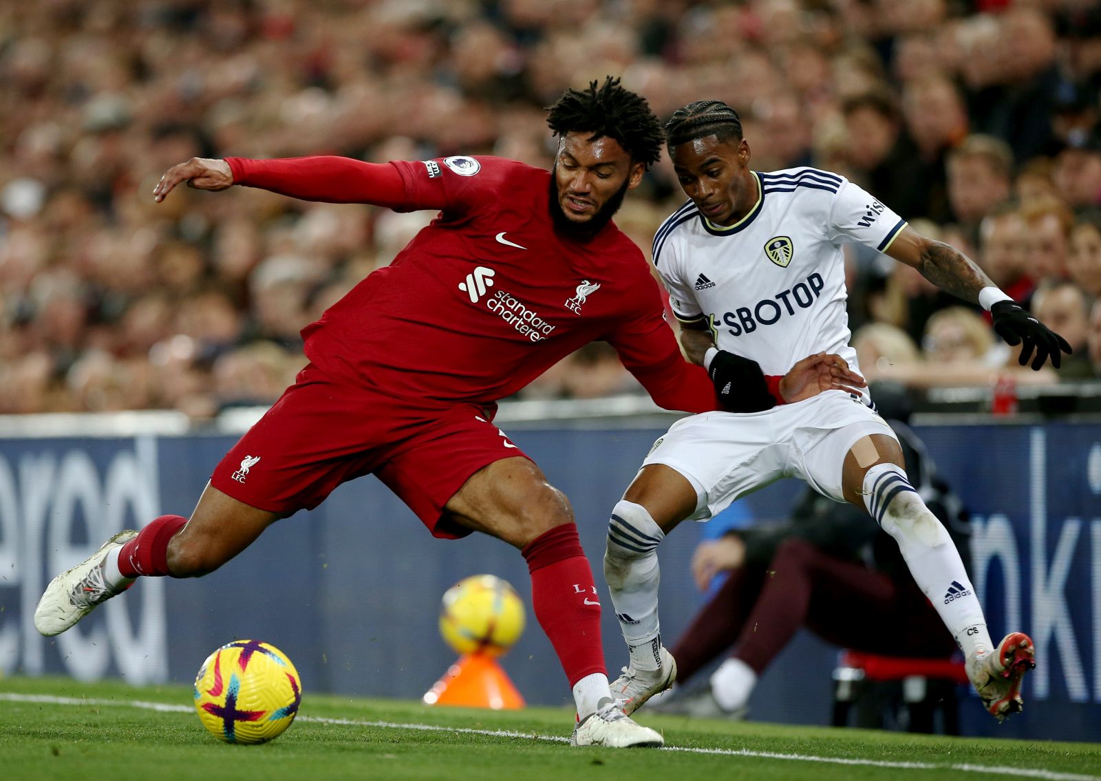 epa10274045 Liverpool's Joe Gomez (L) in action against Leeds' Crysencio Summerville (R) during the English Premier League soccer match between Liverpool FC and Leeds United in Liverpool, Britain, 29 October 2022.  EPA/ADAM VAUGHAN EDITORIAL USE ONLY. No use with unauthorized audio, video, data, fixture lists, club/league logos or 'live' services. Online in-match use limited to 120 images, no video emulation. No use in betting, games or single club/league/player publications