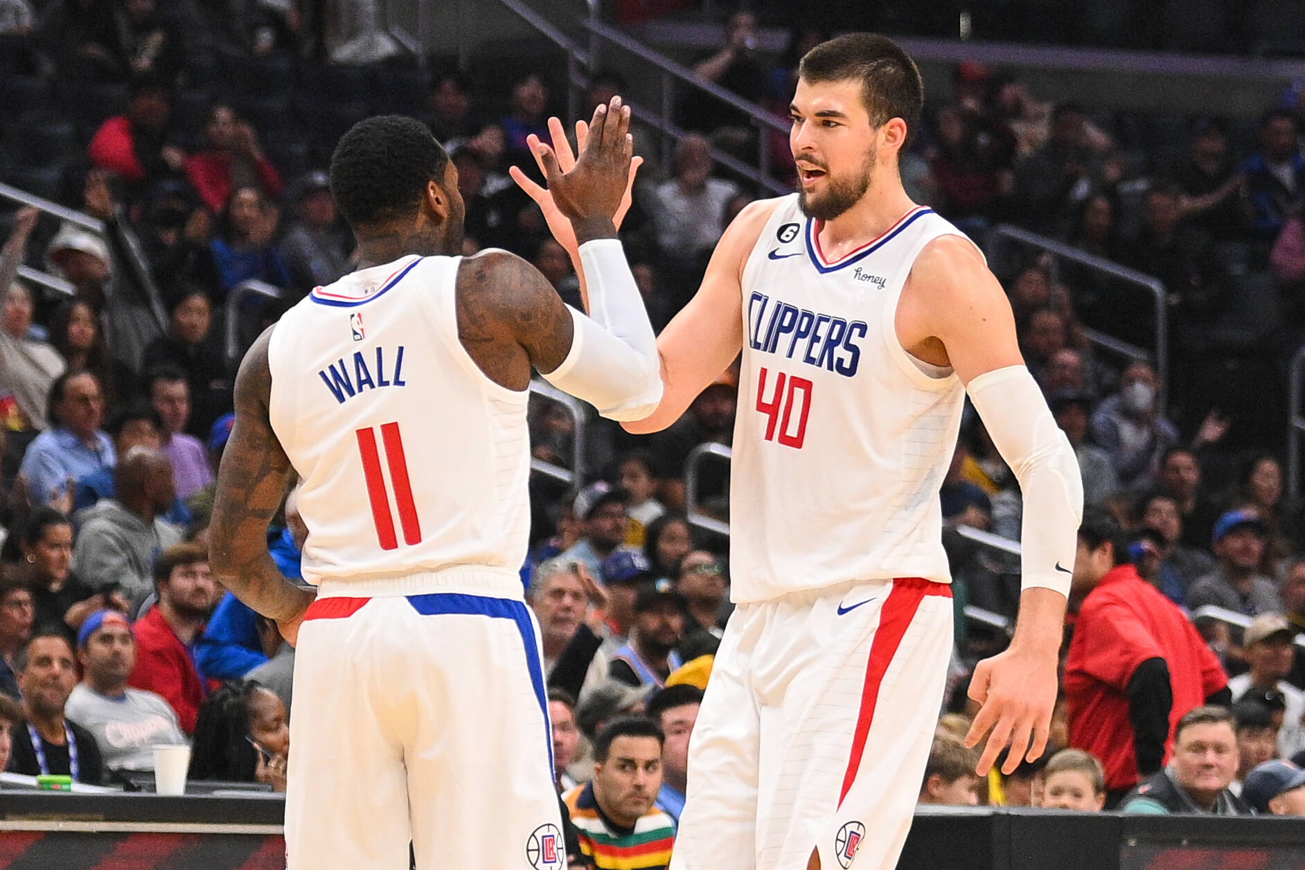LOS ANGELES, CA - NOVEMBER 27: Los Angeles Clippers Guard John Wall 11 and Los Angeles Clippers Center Ivica Zubac 40 celebrate during a NBA, Basketball Herren, USA game between the Indiana Pacers and the Los Angeles Clippers on November 27, 2022 at Crypto.com Arena in Los Angeles, CA. Photo by Brian Rothmuller/Icon Sportswire NBA: NOV 27 Pacers at Clippers Icon221127041