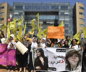 epa10232536 Kurdish women supporters of the Kurdistan Workers' Party (PKK) carry placards and wave party flags with portraits of their jailed leader Abdullah Ocalan, during a protest against the death of Mahsa Amini, an Iranian woman and in solidarity with women-led protests in Iran, in front of the headquarters of the United Nations (ESCWA) in downtown Beirut, Lebanon, 09 October 2022.  EPA/WAEL HAMZEH