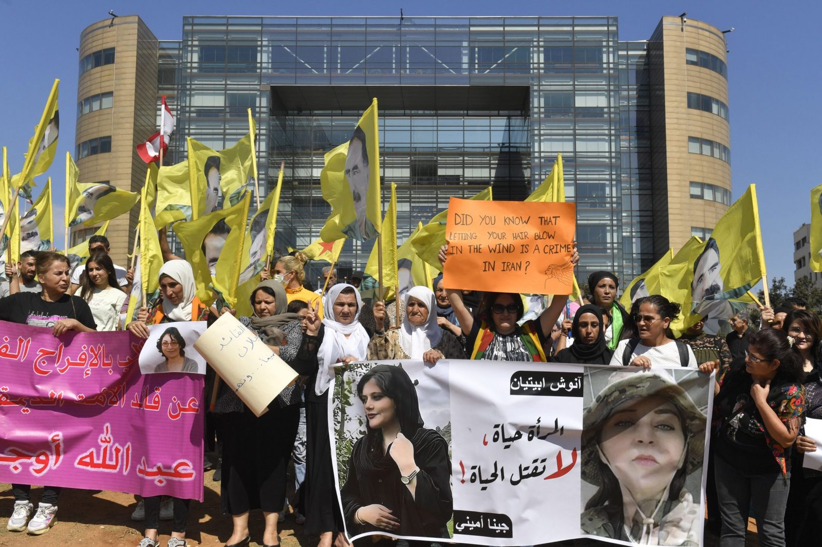 epa10232536 Kurdish women supporters of the Kurdistan Workers' Party (PKK) carry placards and wave party flags with portraits of their jailed leader Abdullah Ocalan, during a protest against the death of Mahsa Amini, an Iranian woman and in solidarity with women-led protests in Iran, in front of the headquarters of the United Nations (ESCWA) in downtown Beirut, Lebanon, 09 October 2022.  EPA/WAEL HAMZEH