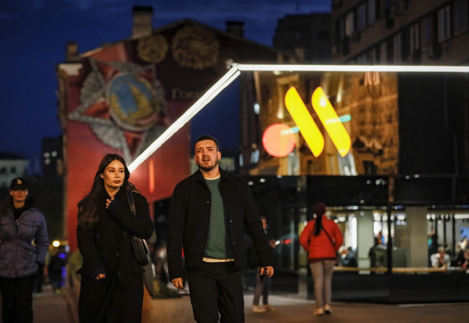 epa10253337 Russian people pass by a former McDonald's restaurant that reopened under a new brand name, 'Vkusno I Tochka (lit.: Tasty, period), in Moscow, Russia, 19 October 2022. Due to events in Ukraine, McDonald's Corporation ceased its operations in Russia. In May 2022, after the announcement of the plans to exit the Russian market, the company sold its Russian business to a Russian businessman, McDonald's franchisee partner Alexander Govor, who is developing the fast-food chain under the new brand name Vkusno I Tochka.  EPA/YURI KOCHETKOV