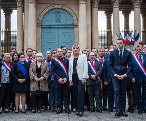 epa10255208 French far-right party Rassemblement National (RN) leader and Member of Parliament Marine Le Pen (C) and European Parliament member Jordan Bardella (C-R) flanked by RN’s Mps gather in front of the National Assembly to observe a minute of silence for Lola,  a young girl murdered in a northern district of French capital, in Paris, France, 20 October 2022. Lola, aged 12, was found dead in a trunk near the building where her parents are caretakers. Her death has sparked a political controversy over immigration as an Algerian woman has been arrested and is suspected of being the perpetrator.  EPA/CHRISTOPHE PETIT TESSON