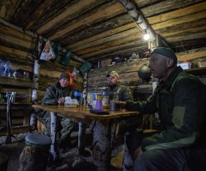 epa10257068 Servicemen of a Ukrainian National Guard rest in their dugout at the position on the north of Kharkiv region, northeastern Ukraine, 21 October 2022. The Ukrainian army pushed Russian troops from occupied territory in the northeast of the country in counterattacks. Kharkiv and surrounding areas have been the target of heavy shelling since February 2022, when Russian troops entered Ukraine starting a conflict that has provoked destruction and a humanitarian crisis.  EPA/SERGIY KOZLOV