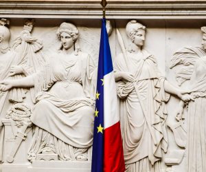 epa10263410 French and an EU flags at the National Assembly in Paris, France, 24 October 2022. The left-wing parliamentary groups of the 'Nupes' coalition (New Popular Ecological and Social Union) and far right-wing deputies of RN (Rassemblement National) have tabled each one a motion of censure against the government of Prime Minister Elisabeth Borne after the application of Article 49 paragraph 3 of the Constitution to vote the state budget.  EPA/TERESA SUAREZ