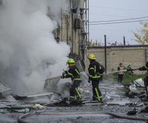 epa10264089 Russian firefighters extinguish a fire at the site of a car explosion near the 'ZaTV' broadcaster building in Melitopol, Zaporizhzhia region, southeastern Ukraine, 25 October 2022. At least five people were injured after a car exploded near the building of the 'ZaTV' television company in the city of Melitopol, said journalist Alexander Malkevich, a member of the Russian Public Chamber who oversees the work of the television company.  EPA/STRINGER