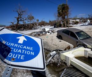 epa10270024 A hurricane evacuation route sign is seen down a month after Hurricane Ian's passage across Florida in Fort Myers beach, Florida, USA, 27 October 2022. Hurricane Ian was a destructive Category 4 Atlantic hurricane, that caused extensive damage across western Cuba, Florida and the southeastern Atlantic coast.  EPA/CRISTOBAL HERRERA-ULASHKEVICH