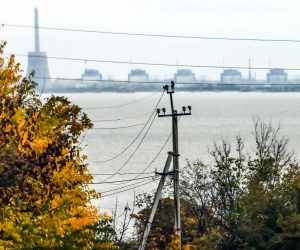 epa10271117 The Zaporizhzhia nuclear power plant (ZNPP) is seen from Nikopol, Ukraine, 28 October 2022. According to a statement by IAEA director general chief Grossi from 28 October 2022, engineers at the ZNPP have been working to stabilize the facility’s external power supplies. The plant has received the power needed to cool the reactors "directly and without interruption from the national grid," the nuclear watchdog's chief said. Russian troops on 24 February entered Ukrainian territory, starting a conflict that has provoked destruction and a humanitarian crisis.  EPA/HANNIBAL HANSCHKE