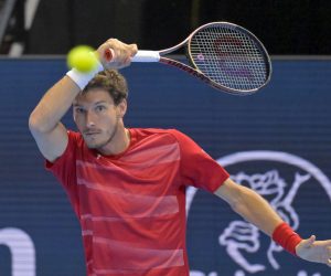 epa10271539 Spain's Pablo Carreno Busta returns a ball to Spain's Carlos Alcaraz during their quarterfinal match at the Swiss Indoors tennis tournament in Basel, Switzerland, 28 October 2022.  EPA/GEORGIOS KEFALAS