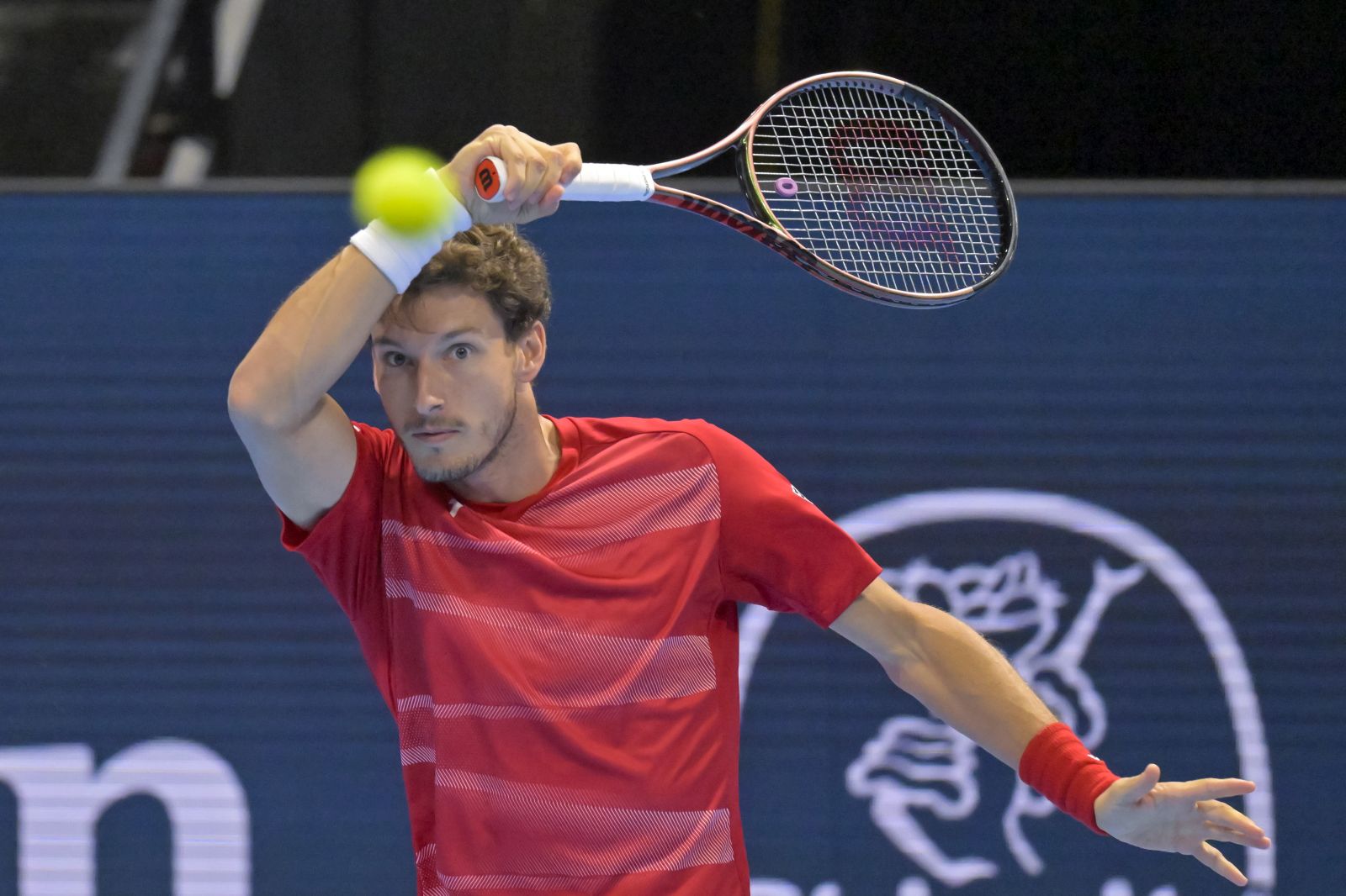 epa10271539 Spain's Pablo Carreno Busta returns a ball to Spain's Carlos Alcaraz during their quarterfinal match at the Swiss Indoors tennis tournament in Basel, Switzerland, 28 October 2022.  EPA/GEORGIOS KEFALAS