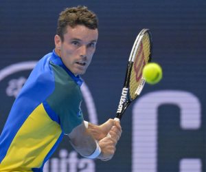 epa10271729 Spain's Roberto Bautista Agut returns a ball to Switzerland's Stan Wawrinka during their quarterfinal match at the Swiss Indoors tennis tournament in Basel, Switzerland, 28 October 2022.  EPA/GEORGIOS KEFALAS