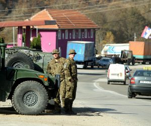 epa10279178 Members of the Latvian contingent of NATO-led international peacekeeping force in Kosovo (KFOR) observe the Jarinje border crossing between Kosovo and Serbia at Jarinje, Kosovo, 01 November 2022. The Government of Kosovo will begin implementing a plan to eliminate the usage of Serbian car license plates. All owners of vehicles with Serbian number plates are warned and requested to visit any of the Vehicle Registration Centers and register their vehicles with RKS license plates. In the Serbian community of Kosovo, the RKS license plates are seen as unacceptable as they suggest the recognition of independence of the Republic of Kosovo.  EPA/DJORDJE SAVIC