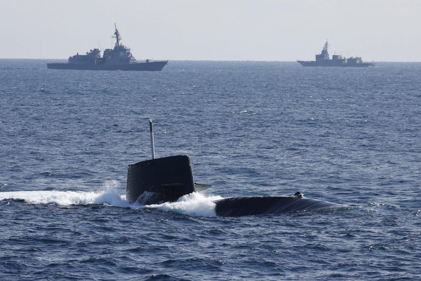 epa10289599 The Uzushio-class submarine of the Japan Maritime Self-Defense Force (JMSDF) bursts to the surface during International Fleet Review to commemorate the 70th anniversary of the foundation of the JMSDF at Sagami Bay, off Yokosuka, south of Tokyo, Japan, 06 November 2022.  EPA/ISSEI KATO / POOL