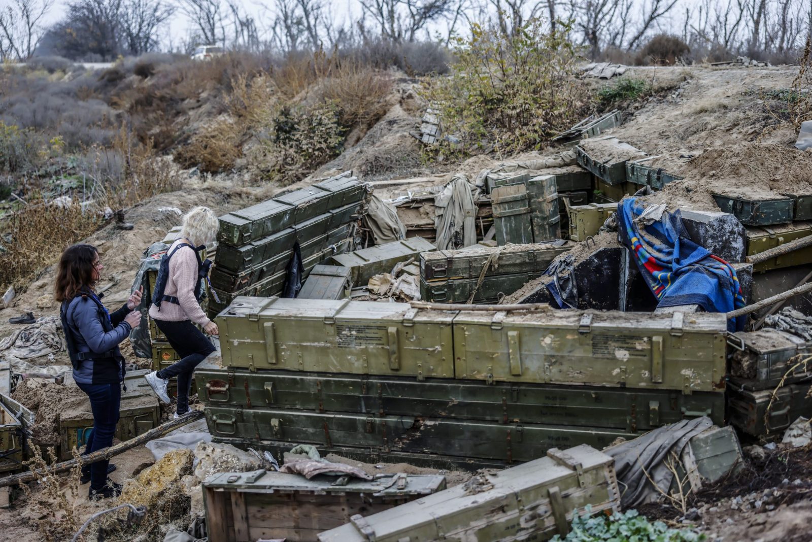 epa10290092 Volunteers of the 'World Foundation for Ukraine' inspect a former Russian military fortification at the northern Kherson region, 06 November 2022. The city of Kherson on the Black Sea coast was seized by Russia in the first month after its invasion of Ukraine on 24 February. Now it appears that Russia might be about to give up at least part of it as it prepares defensive lines for the winter.  EPA/HANNIBAL HANSCHKE