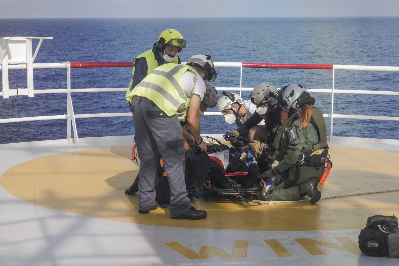 epa10298362 A handout photo made available by Sos Mediterranee shows one of the three migrants in need of medical care being prepared for evacuation by a helicopter of the French Army from the Ocean Viking rescue ship, in the Tyrrhenian Sea between Italy and Corsica island, 10 November 2022. SOS Mediterranee, wich operates the Ocean Viking ship, announced on 10 November that the rescue ship will be allowed for the disembarkation of the 230 migrants remaining onboard the vessel in Toulon, France. The announcement follows the medical evacuation by French authorities with a helicopter of three patients needing hospital care and one relative, after weeks at sea when migrants were rescued in several operations in October.  EPA/CAMILLE MARTIN JUAN/SOS MEDITERRANEE HANDOUT  HANDOUT EDITORIAL USE ONLY/NO SALES