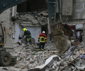 epa10300041 Ukrainian rescuers clean debris after a residential building was hit in a shelling in Mykolaiv, Ukraine, 11 November 2022. At least seven people were killed according to Kyrylo Tymoshenko, the Deputy Head of the Office of the President of Ukraine report. Russian troops on 24 February entered Ukrainian territory, starting a conflict that has provoked destruction and a humanitarian crisis.  EPA/STR