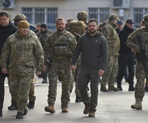 epa10305074 Ukrainian President Volodymyr Zelensky (4-L, front) visits the recaptured city of Kherson, Ukraine, 14 November 2022. Ukrainian troops entered Kherson on 11 November after Russian troops had withdrawn from the city. Kherson was captured in the early stage of the conflict, shortly after Russian troops had entered Ukraine in February 2022.  EPA/OLEG PETRASYUK