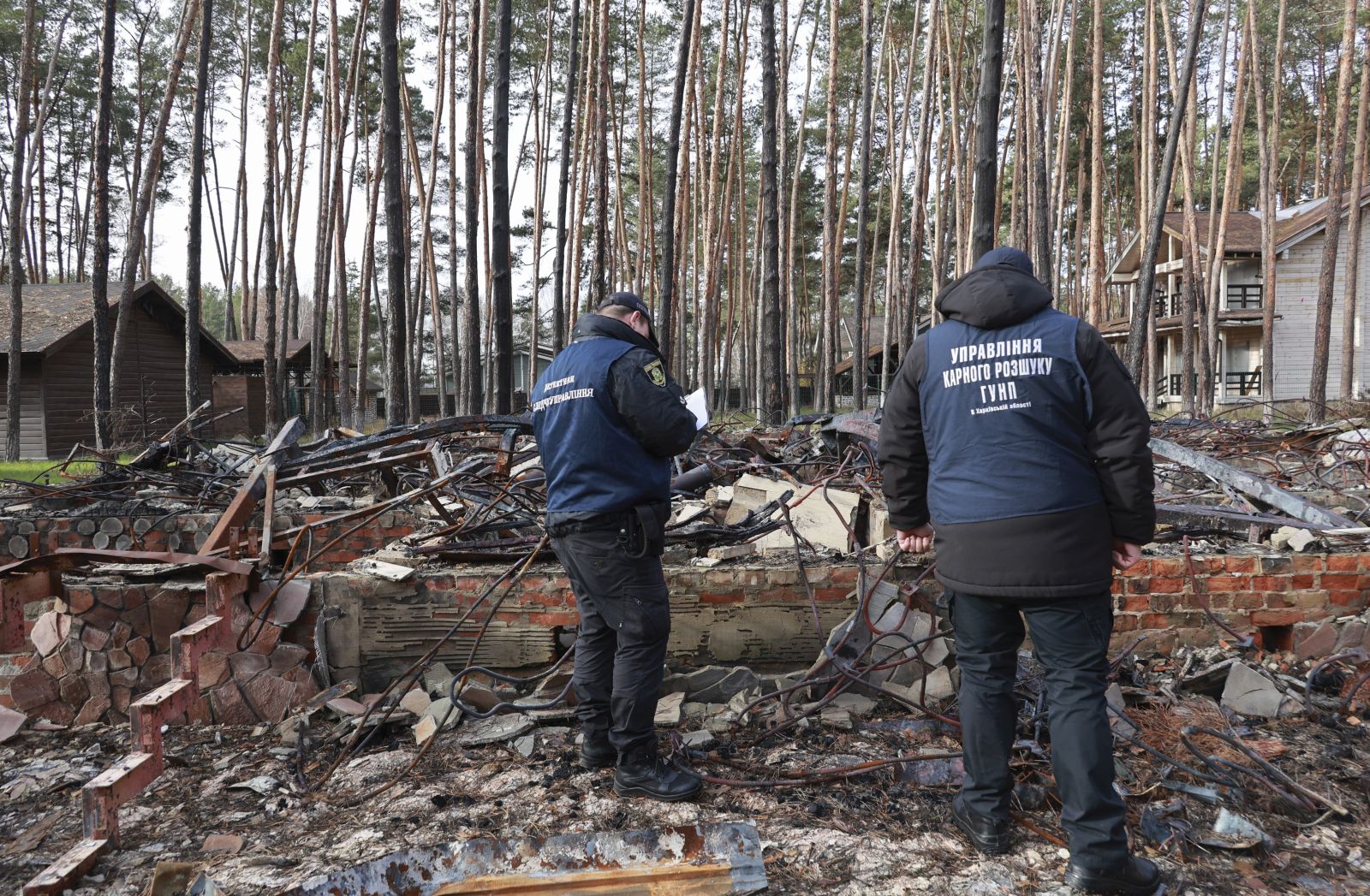 epa10307557 Ukrainian police experts investigate recaptured territory after Russian occupation in Volchansk city of Kharkiv area, Ukraine, 15 November 2022. Kharkiv and surrounding areas have been the target of heavy shelling since February 2022, when Russian troops entered Ukraine starting a conflict that has provoked destruction and a humanitarian crisis. At the beginning of September, the Ukrainian army pushed Russian forces from occupied territory northeast of the country in counterattacks.  EPA/SERGEY KOZLOV