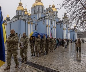 epa10308322 Ukrainian soldiers carry the coffin with the remains of fallen Ukrainian serviceman Yevhenii Kolesnichenko, during a funeral ceremony at St. Michael's Golden-Domed Monastery in Kyiv, Ukraine, 16 November 2022. Yevhenii was killed fighting Russian troops in Donetsk region. On 24 February Russian troops invaded Ukrainian territory starting a conflict that has provoked destruction and a humanitarian crisis.  EPA/ROMAN PILIPEY