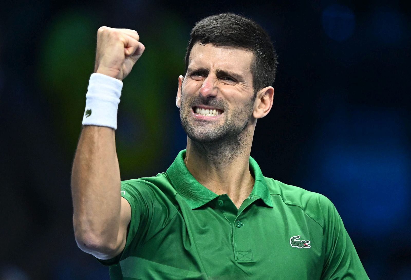 epaselect epa10306066 Novak Djokovic of Serbia celebrates after winning the match against Stefanos Tsitsipas of Greece at the Nitto ATP Finals 2022 tennis tournament at the Pala Alpitour arena in Turin, Italy, 14 November 2022.  EPA/ALESSANDRO DI MARCO
