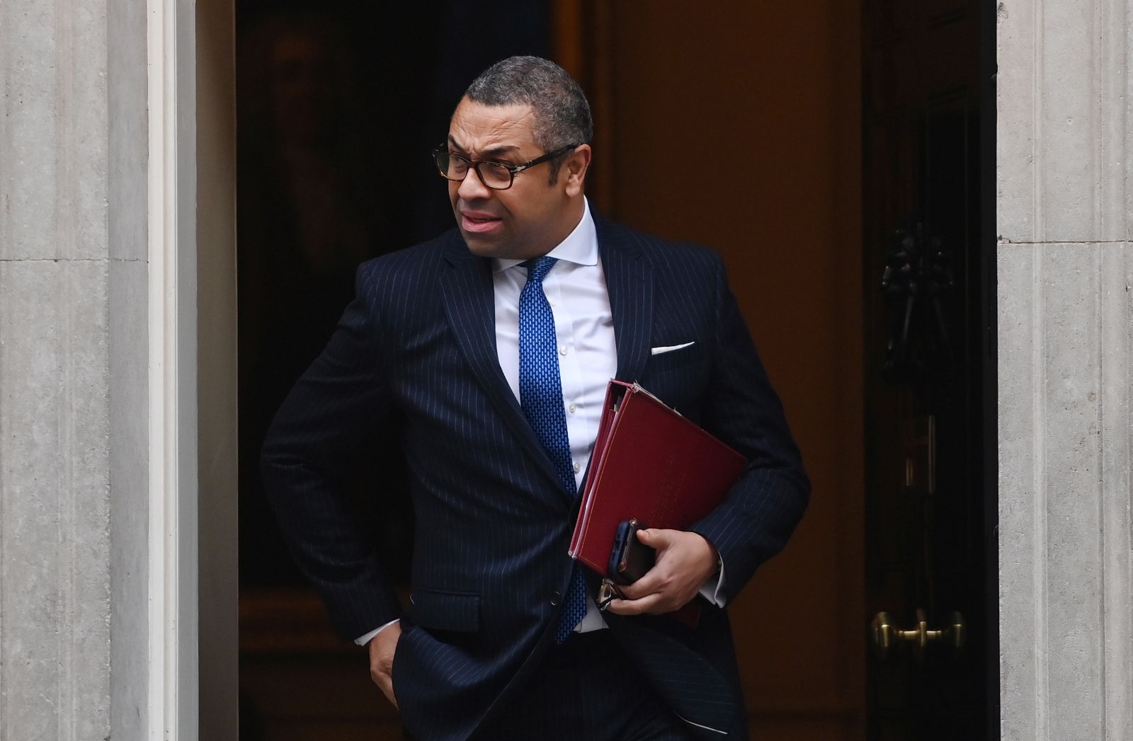 epa10310208 British Foreign Secretary James Cleverly leaves Downing Street following a cabinet meeting in London, Britain, 17 November 2022. British Chancellor of the Exchequer Jeremy Hunt is to deliver his Autumn Statement to parliament on 17 November, with tax rises and government spending cuts expected to help fill a 50 billion pounds black hole in the British finances.  EPA/ANDY RAIN