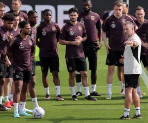 epa10313859 Germany's head coach Hansi Flick (front-R) talks to players during the team's training session in Al Ruwais, Qatar, 19 November 2022. Germany is preparing for the FIFA World Cup 2022 in Qatar with their first match against Japan set for 23 November. The FIFA World Cup Qatar 2022 will take place from 20 November to 18 December 2022 in Qatar.  EPA/FRIEDEMANN VOGEL