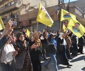epa10315868 People carry flags with photos of Abdullah Ocalan, founding member of the Kurdistan Workers' Party, during a protest against the Turkish attacks in northeast of Syria, in Qamishli, Syria, 20 November 2022. The Turkish Defense Ministry said in a statement that a total of 89 targets of Kurdish militants in northern Syria and Iraq were destroyed during air strikes of the operation dubbed 'Claw-Sword', launched a week after bombing in Istanbul blamed on Kurdish militants killed six people.  EPA/AHMED MARDNLI