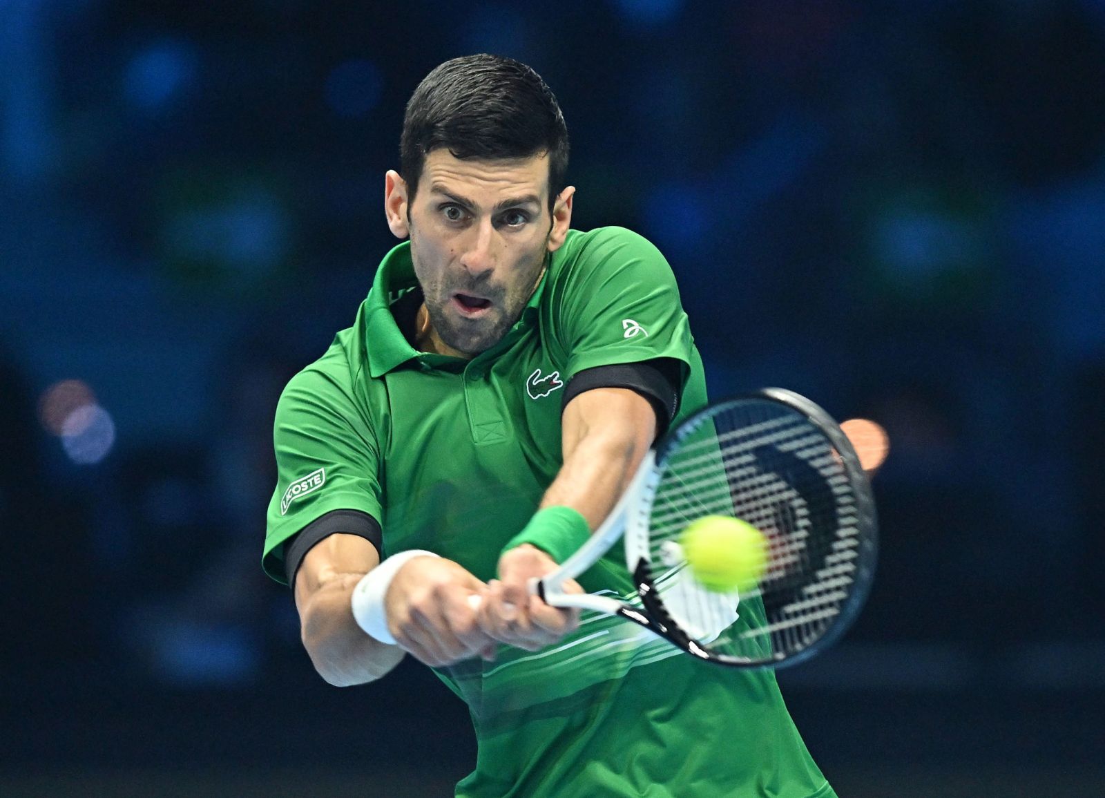epa10316680 Novak Djokovic of Serbia in action against Casper Ruud of Norway during the singles final of the Nitto ATP Finals 2022 tennis tournament at the Pala Alpitour arena in Turin, Italy, 20 November 2022.  EPA/ALESSANDRO DI MARCO                   ITALY OUT