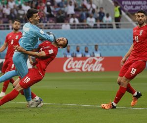 epa10317858 Goalkeeper Ali Beiranvand (L) of Iran collides with a teammate during the FIFA World Cup 2022 group B soccer match between England and Iran at Khalifa International Stadium in Doha, Qatar, 21 November 2022.  EPA/Ronald Wittek