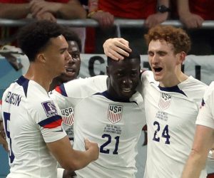 epa10318922 Timothy Weah (3L) of the USA celebrates with teammates after scoring the opening goal during the FIFA World Cup 2022 group B soccer match between the USA and Wales at Ahmad bin Ali Stadium in Doha, Qatar, 21 November 2022.  EPA/Ronald Wittek