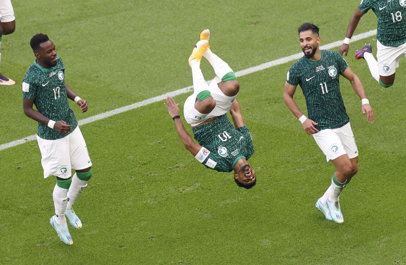 epa10319995 Salem Aldawsari of Saudi Arabia (C) celebrates with teammates scoring the 2-1 during the FIFA World Cup 2022 group C soccer match between Argentina and Saudi Arabia at Lusail Stadium in Lusail, Qatar, 22 November 2022.  EPA/Rungroj Yongrit