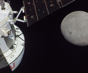 epa10320024 A handout photo made available by the NASA shows a portion of the far side of the Moon looms large just beyond the Orion spacecraft in this image taken on the sixth day of the Artemis I mission by a camera on the tip of one of Orion's solar arrays on 21 November 2022 (issued 22 November 2022). The spacecraft entered the lunar sphere of influence on 20 November making the Moon instead of Earth the main gravitational force acting on the spacecraft On 21 November iit came within 80 miles of the lunar surface the closest approach of the uncrewed Artemis I mission before moving into a distant retrograde orbit around the Moon. The darkest spot visible near the middle of the image is Mare Orientale.  EPA/NASA HANDOUT  HANDOUT EDITORIAL USE ONLY/NO SALES