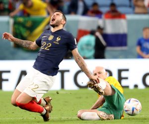 epa10321483 Theo Hernandez (L) of France in action against Aaron Mooy of Australia during the FIFA World Cup 2022 group D soccer match between France and Australia at Al Janoub Stadium in Al Wakrah, Qatar, 22 November 2022.  EPA/Abedin Taherkenareh