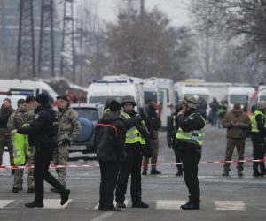 epa10322779 Police officers stand near a cordon and ambulance vehicles near the site of an infrastructure object hit by shelling in Kyiv (Kiev), Ukraine, 23 November 2022, amid Russia's invasion. At least three people were killed and seven others injured as a result of shelling on a two-story building in Kyiv, the Kyiv City Military Administration reported on telegram. According to a statement by Ukraine's national power supply Ukrenergo on 23 November, power outages were reported across all of the regions of the country following a series of Russian missile strikes targeting the country's critical infrastructure. Russian troops entered Ukraine on 24 February 2022 starting a conflict that has provoked destruction and a humanitarian crisis.  EPA/SERGEY DOLZHENKO