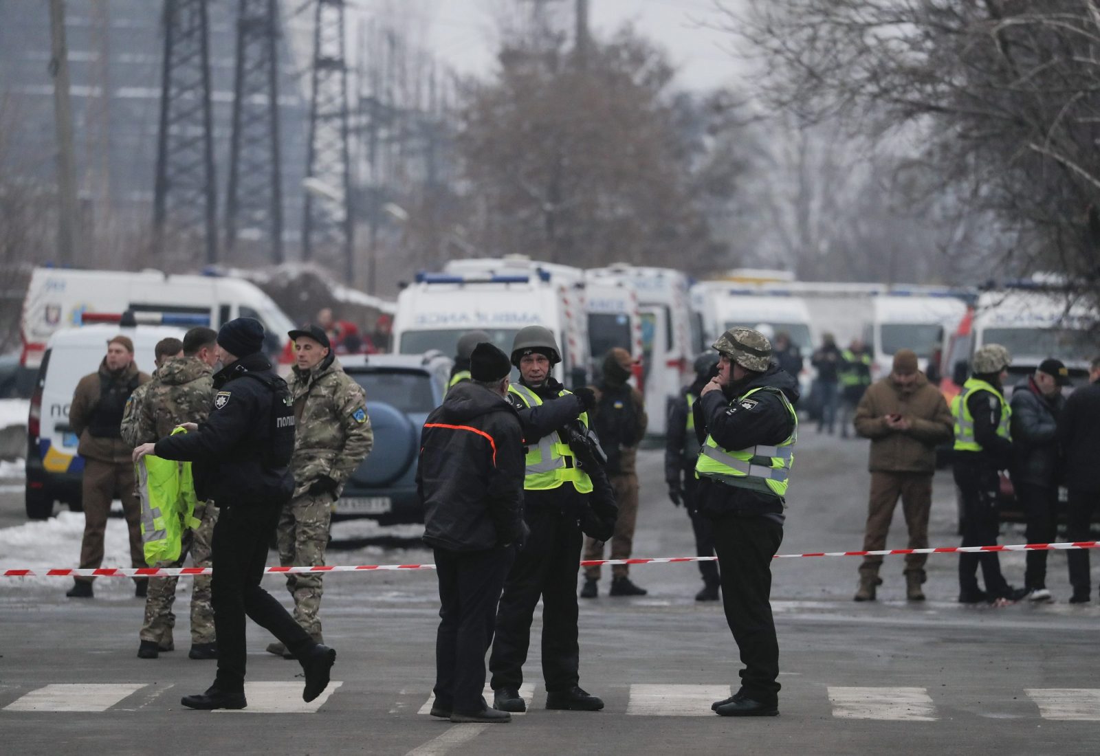 epa10322779 Police officers stand near a cordon and ambulance vehicles near the site of an infrastructure object hit by shelling in Kyiv (Kiev), Ukraine, 23 November 2022, amid Russia's invasion. At least three people were killed and seven others injured as a result of shelling on a two-story building in Kyiv, the Kyiv City Military Administration reported on telegram. According to a statement by Ukraine's national power supply Ukrenergo on 23 November, power outages were reported across all of the regions of the country following a series of Russian missile strikes targeting the country's critical infrastructure. Russian troops entered Ukraine on 24 February 2022 starting a conflict that has provoked destruction and a humanitarian crisis.  EPA/SERGEY DOLZHENKO