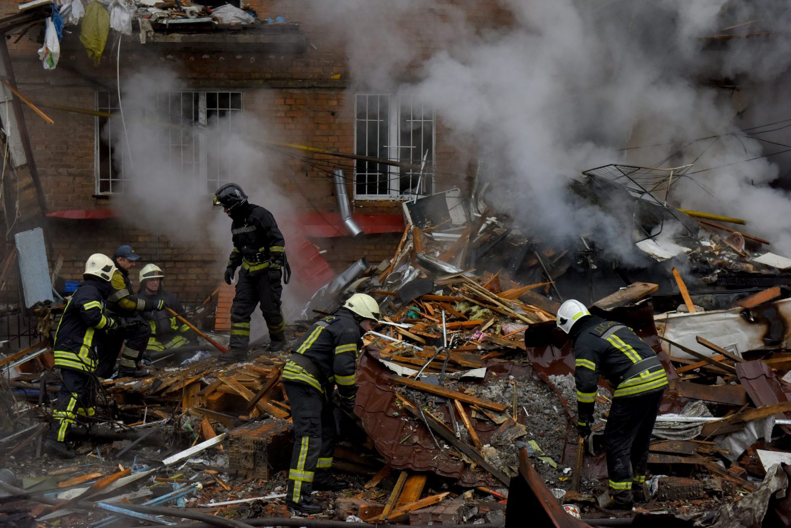 epa10323452 Firefighters work at the site of an apartment block destroyed by shelling in Vyshhorod, near Kyiv (Kiev), Ukraine, 23 November 2022, amid Russia's invasion. At least four people were killed and 27 others injured as a result of Russian shelling hitting the Vyshhorod district, Kyiv Oblast Police Chief Andrii Nebytov said on telegram. According to a statement by Ukraine's national power supply Ukrenergo on 23 November, power outages were reported across all of the regions of the country following a series of Russian missile strikes targeting Ukraine's critical infrastructure. Russian troops on 24 February entered Ukrainian territory, starting a conflict that has provoked destruction and a humanitarian crisis.  EPA/OLEG PETRASYUK