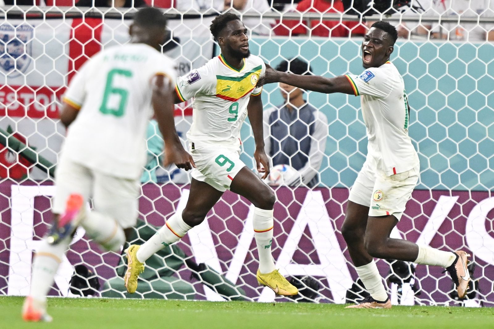 epa10327506 Boulaye Dia (C) of Sengal celebrates after scoring the 1-0 goal during the FIFA World Cup 2022 group A soccer match between Qatar and Senegal at Al Thumama Stadium in Doha, Qatar, 25 November 2022.  EPA/Noushad Thekkayil