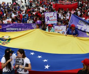 epa10328734 Chavista women participate in a march to raise their voices against violence against women in the framework of the celebration of '25N', the International Day for the Elimination of Violence against Women, in Caracas, Venezuela, 25 November 2022.  EPA/Rayner Peña
