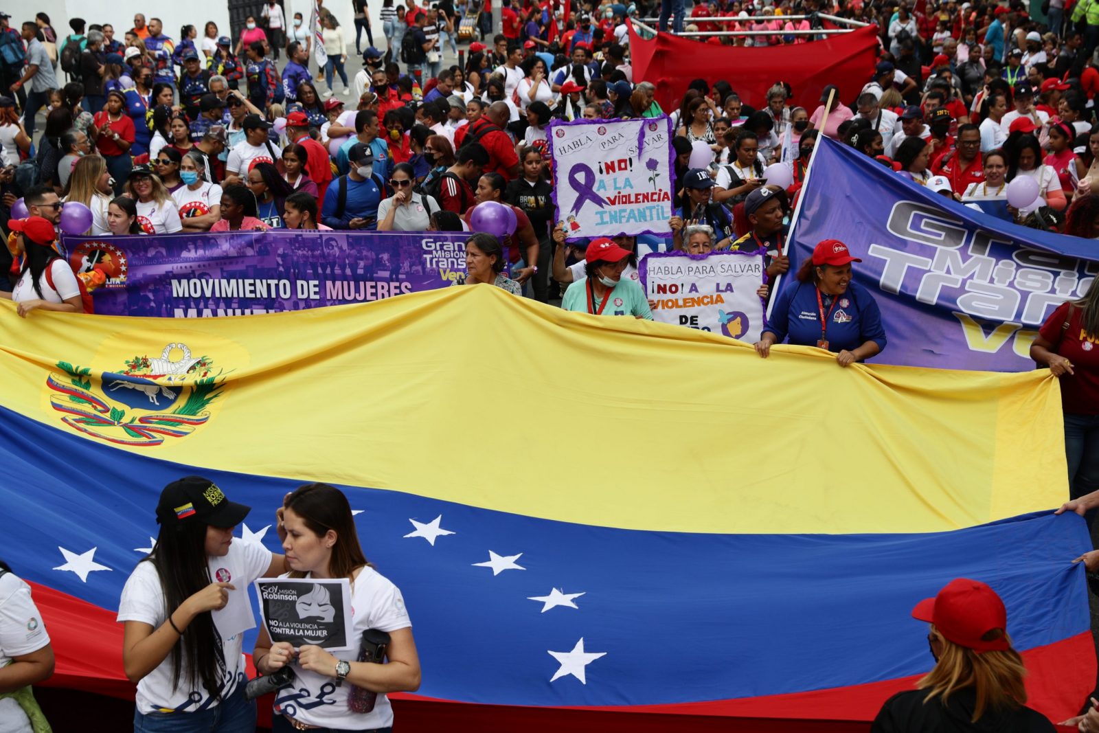epa10328734 Chavista women participate in a march to raise their voices against violence against women in the framework of the celebration of '25N', the International Day for the Elimination of Violence against Women, in Caracas, Venezuela, 25 November 2022.  EPA/Rayner Peña