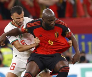 epa10332385 Romelu Lukaku of Belgium in action against Romain Saiss (L) of Morocco during the FIFA World Cup 2022 group F soccer match between Belgium and Morocco at Al Thumama Stadium in Doha, Qatar, 27 November 2022.  EPA/Rungroj Yongrit