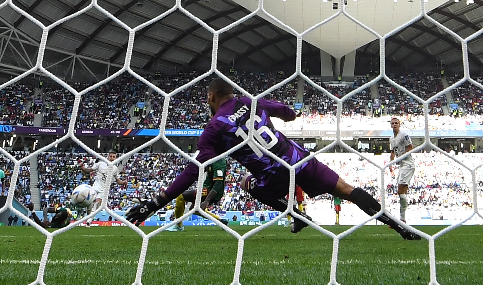 epa10333846 Goalkeeper Devis Epassy of Cameroon is beaten as Serbia score their second goal during the FIFA World Cup 2022 group G soccer match between Cameroon and Serbia at Al Janoub Stadium in Al Wakrah, Qatar, 28 November 2022.  EPA/Neil Hall
