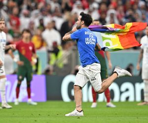 epa10335306 A pitch invader during the FIFA World Cup 2022 group H soccer match between Portugal and Uruguay at Lusail Stadium in Lusail, Qatar, 28 November 2022.  EPA/Noushad Thekkayil
