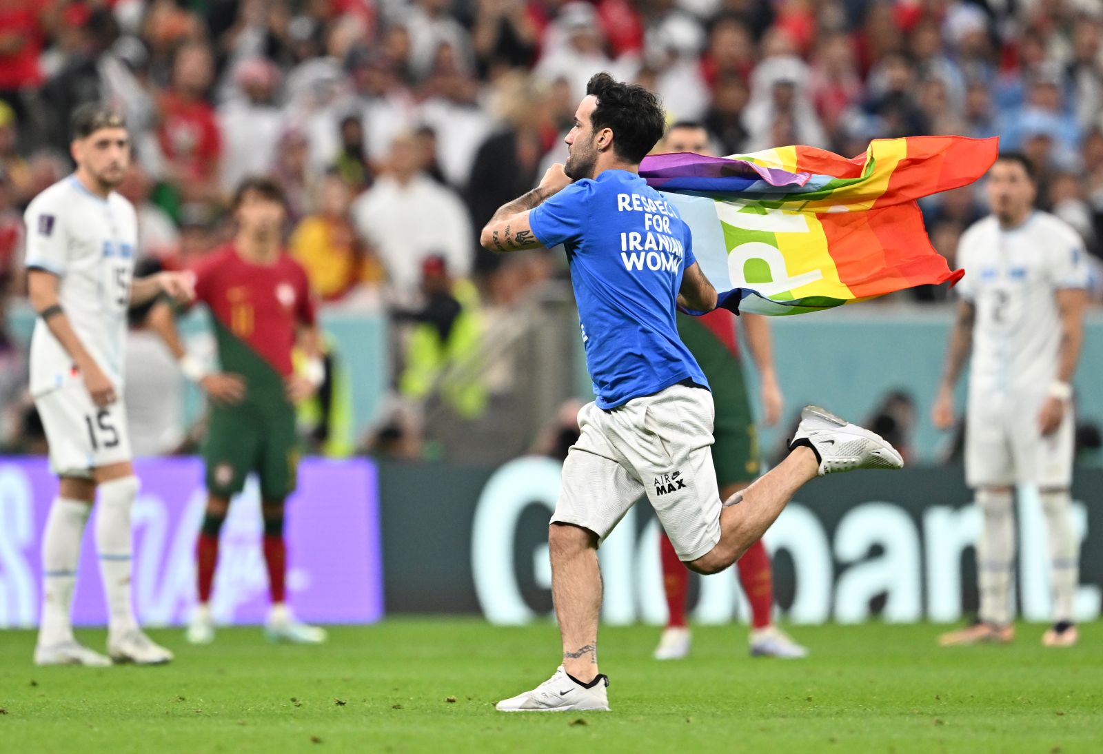 epa10335306 A pitch invader during the FIFA World Cup 2022 group H soccer match between Portugal and Uruguay at Lusail Stadium in Lusail, Qatar, 28 November 2022.  EPA/Noushad Thekkayil