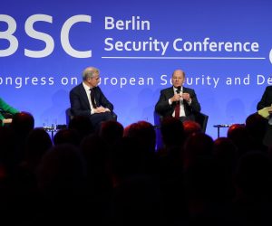 epa10339558 German Chancellor Olaf Scholz (3-R) speaks next to Norwegian Prime Minister Jonas Gahr Store (2-L), Editor and CDO Behoerden Spiegel Eva-Charlotte Proll (L) and BSC Congress President and Member of German Parliament Wolfgang Hellmich during the Berlin Security Conference (BSC) in Berlin, Germany, 30 November 2022. BSC connects experts from Germany and abroad to discuss matters of foreign policy, security and defense policy.  EPA/CLEMENS BILAN