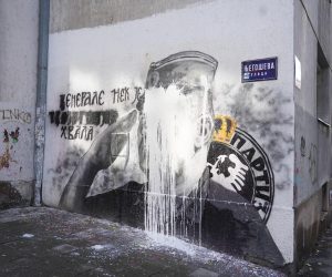 10, November, 2021, Belgrade - A bucket of lime was thrown on the mural with the image of Ratko Mladic, and behind it stands Djordjo Zujovic, a longtime activist and member of the Social Democratic Party of Serbia.   10, novembar, 2021, Beograd  - Na mural sa likom Ratka Mladica bacena je kofa kreca, a iza toga stoji Djordjo Zujovic, dugogodisnji aktivista i clan Socijaldemokratske partije Srbije.  Photo: Antonio Ahel/PIXSELL