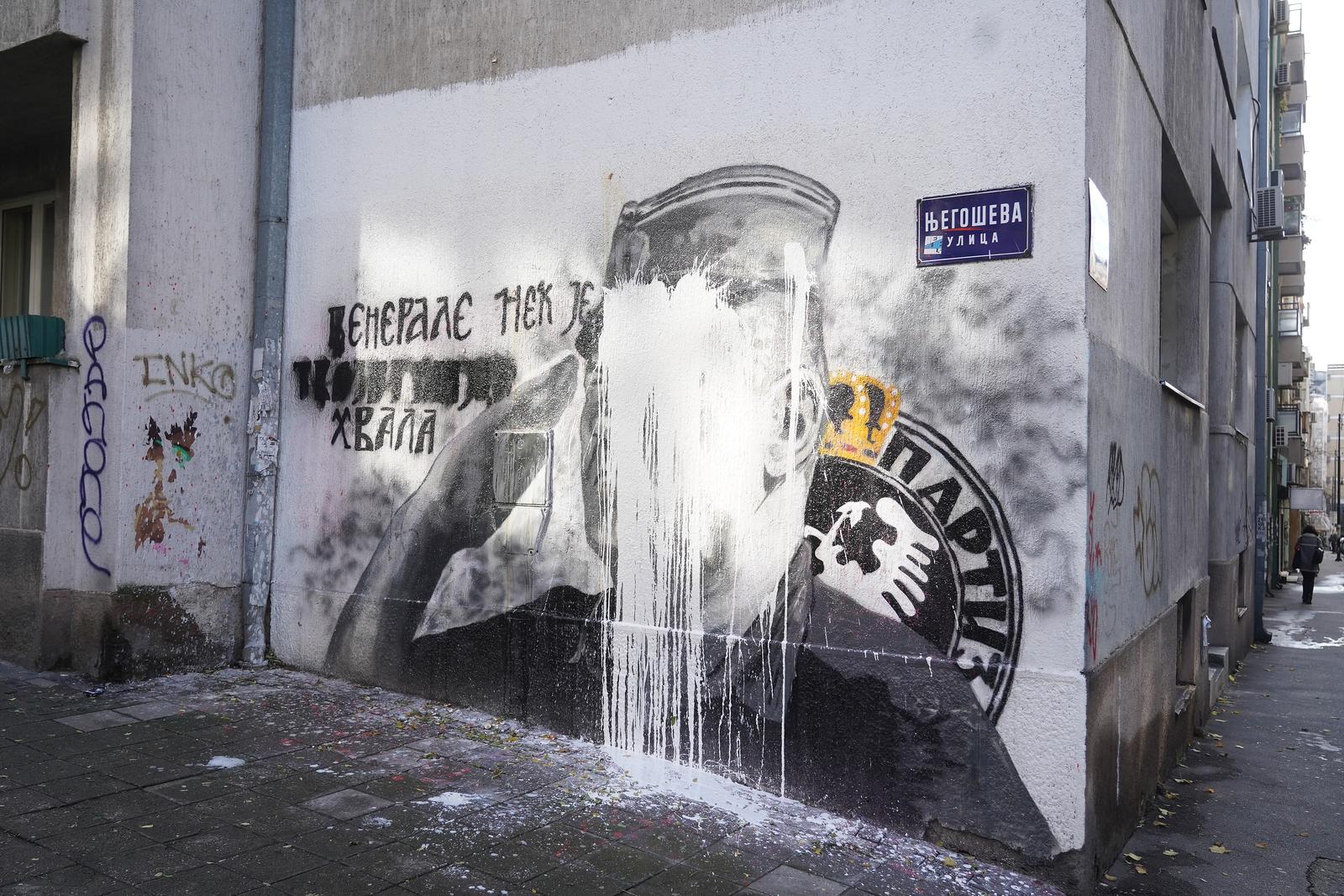10, November, 2021, Belgrade - A bucket of lime was thrown on the mural with the image of Ratko Mladic, and behind it stands Djordjo Zujovic, a longtime activist and member of the Social Democratic Party of Serbia.   10, novembar, 2021, Beograd  - Na mural sa likom Ratka Mladica bacena je kofa kreca, a iza toga stoji Djordjo Zujovic, dugogodisnji aktivista i clan Socijaldemokratske partije Srbije.  Photo: Antonio Ahel/PIXSELL